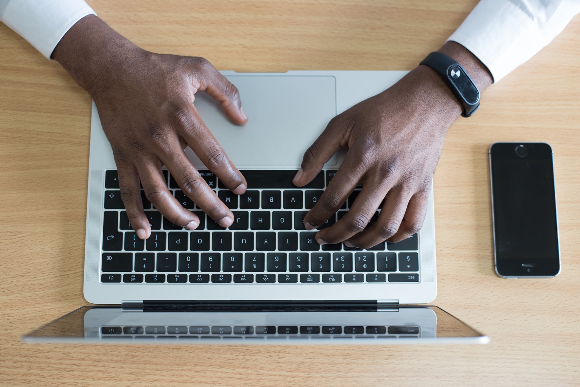 A person processing payroll on his laptop