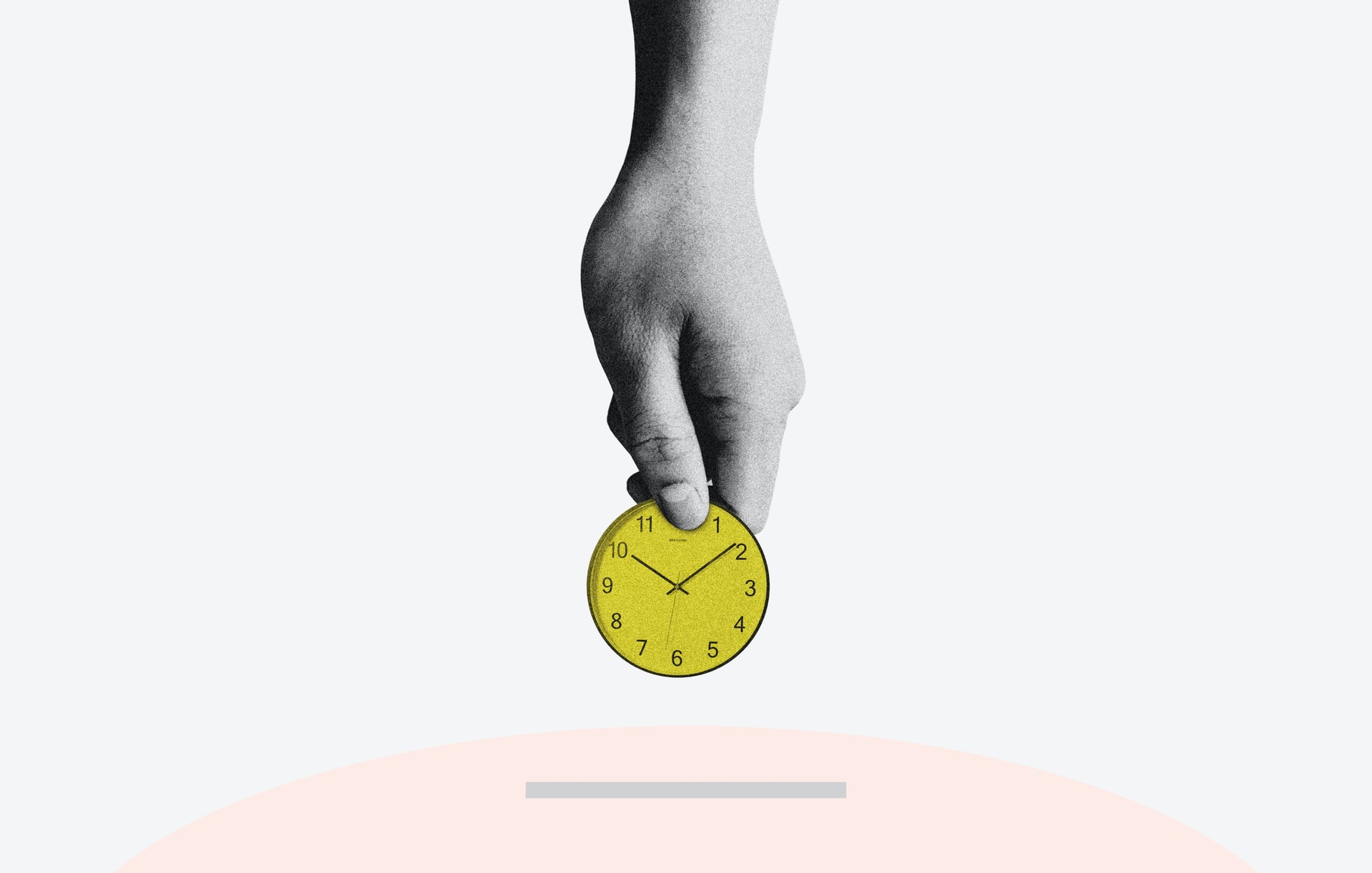 A hand holding a sketched yellow clock